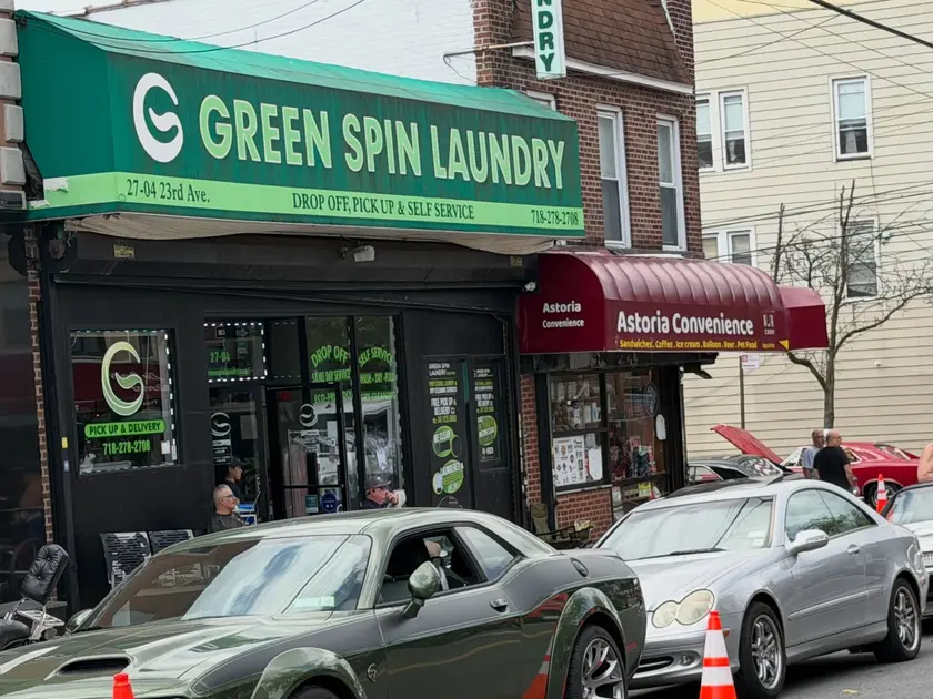 Green Spin Laundry storefront at 27-04 23rd Avenue in Astoria, Queens, with its green sign